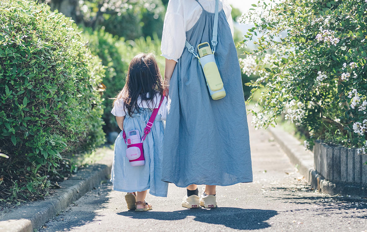 Parent and child with their bottles.