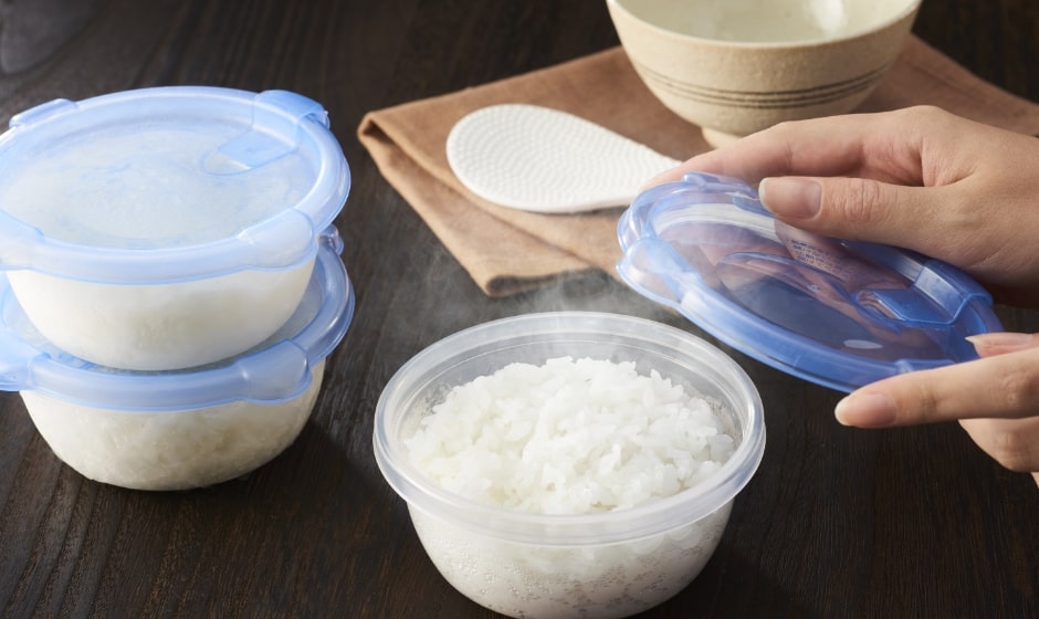Lifting a mouthful of rice with chopsticks