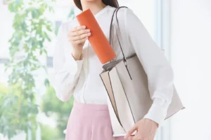 Taking her bottle out.