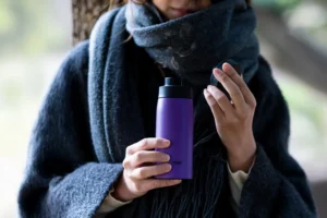 Steam rising from the bottle.